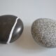 2 boxes in lithographed sheet metal in the shape of a pebble