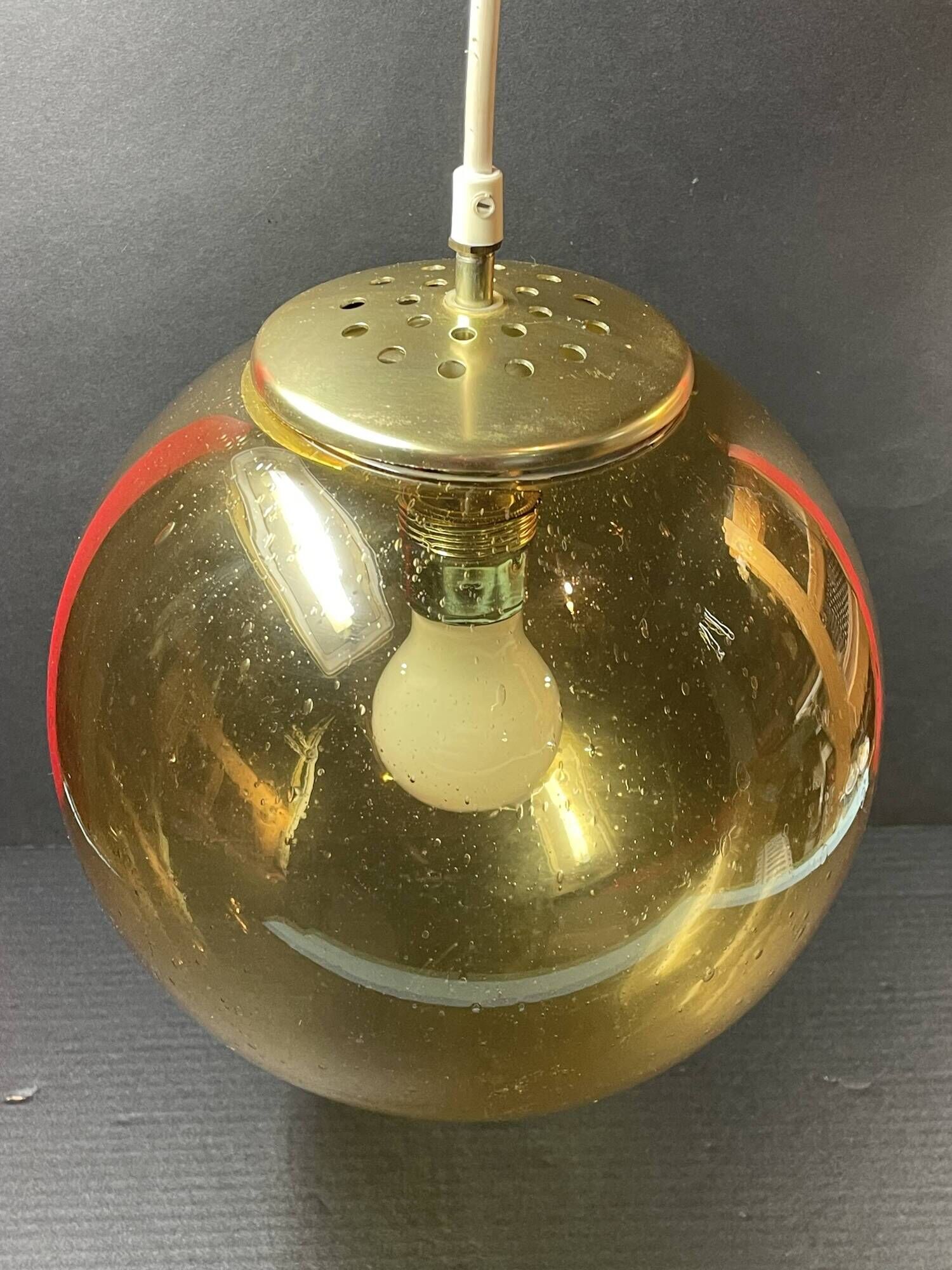 Pair of vintage smoked glass ball pendant lights from Biot glassworks