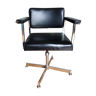 Strafor swivel office armchair in chrome metal and black skai