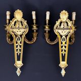 Large pair of gilt bronze wall sconces in the Louis XVI style.