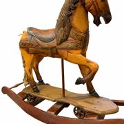 Ancient wooden rocking horse with original paint, hand-carved.