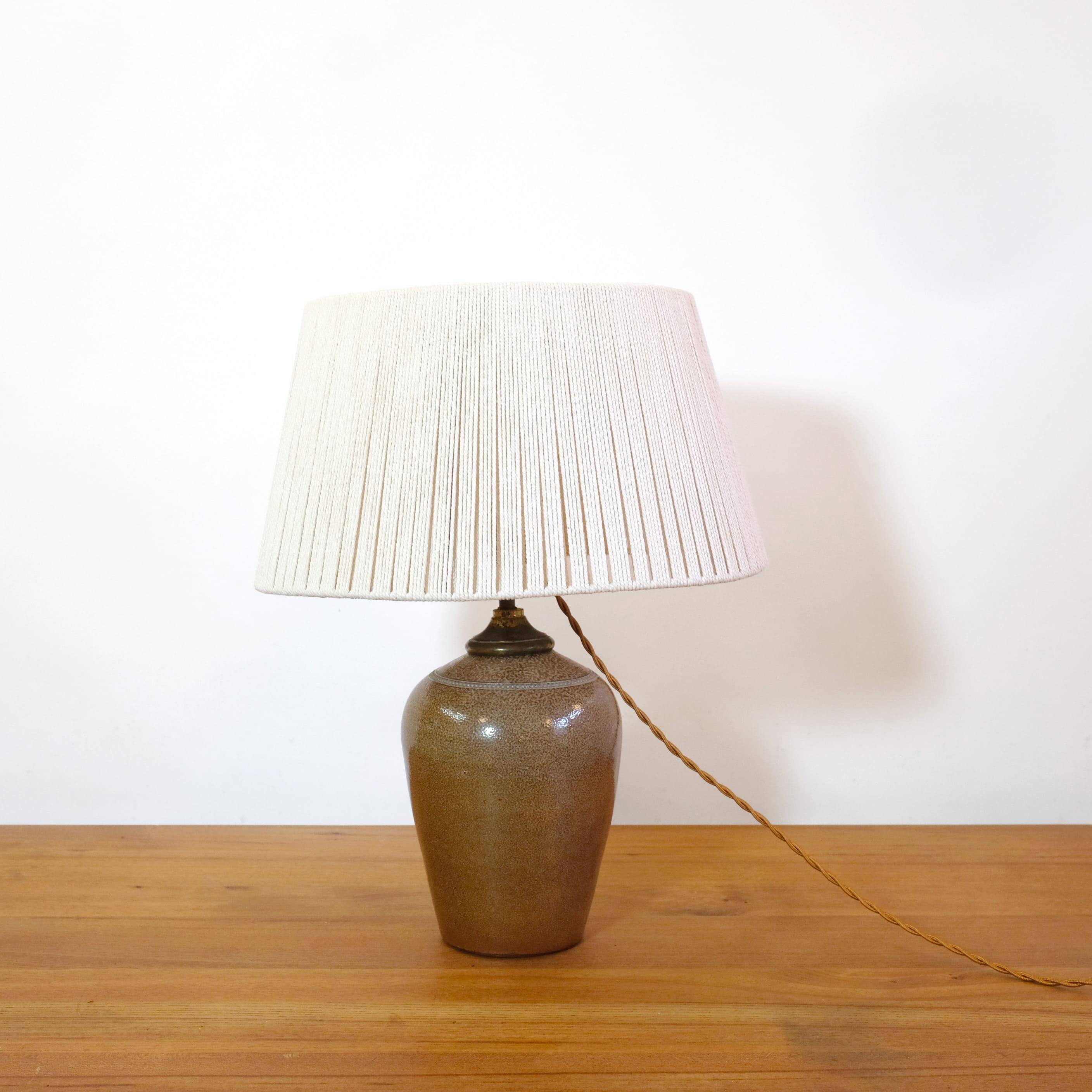 Stoneware lamp with a cotton thread shade, 1970s.