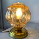 Old vintage table lamp made of amber molded glass