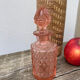 Art Deco perfume bottle in old amber pink glass