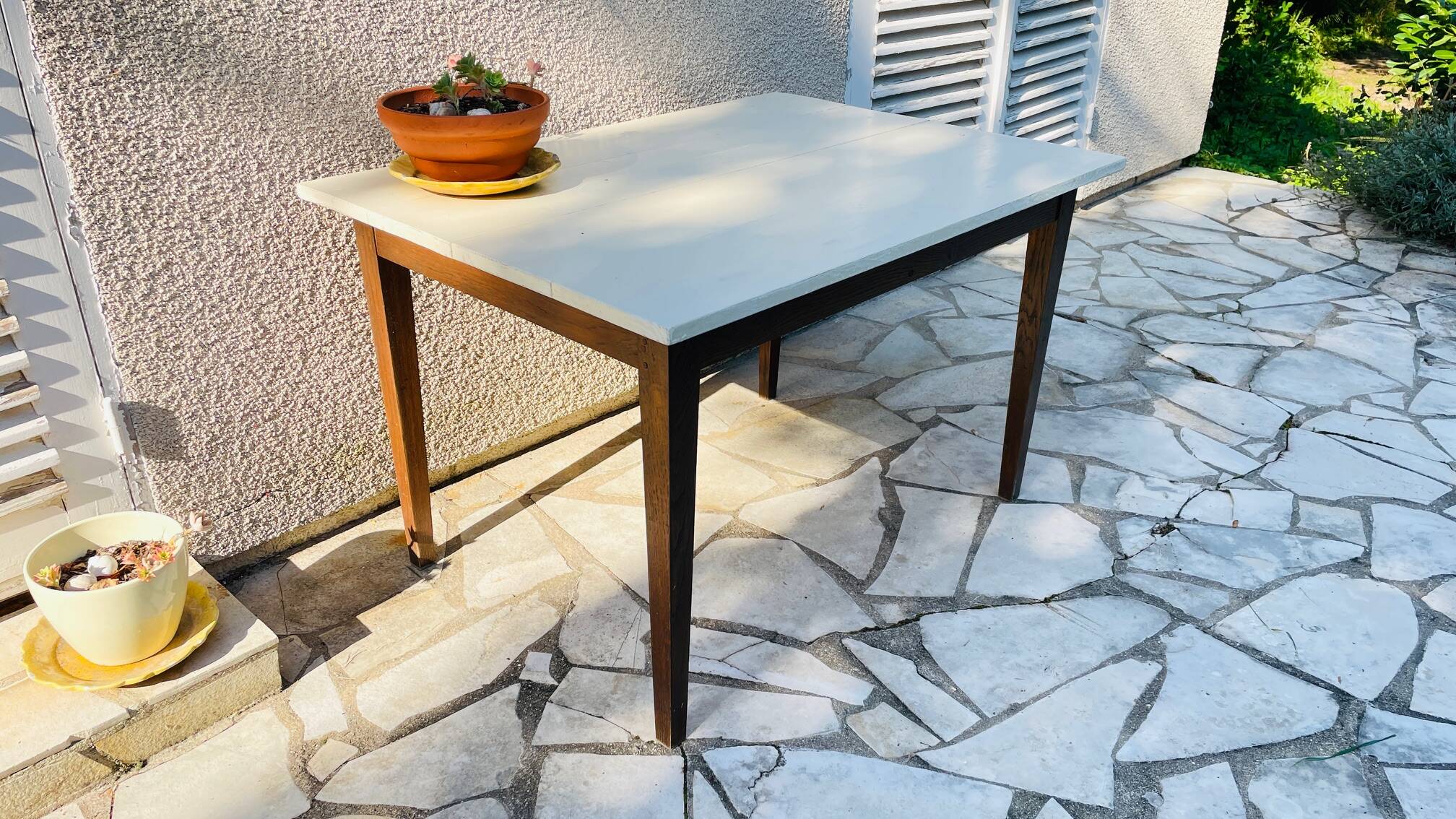 Vintage oak farmhouse table with a white top.