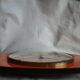 Vintage wall clock in orange formica