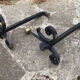 Massive wrought iron chenets from the 19th century topped with brass balls.