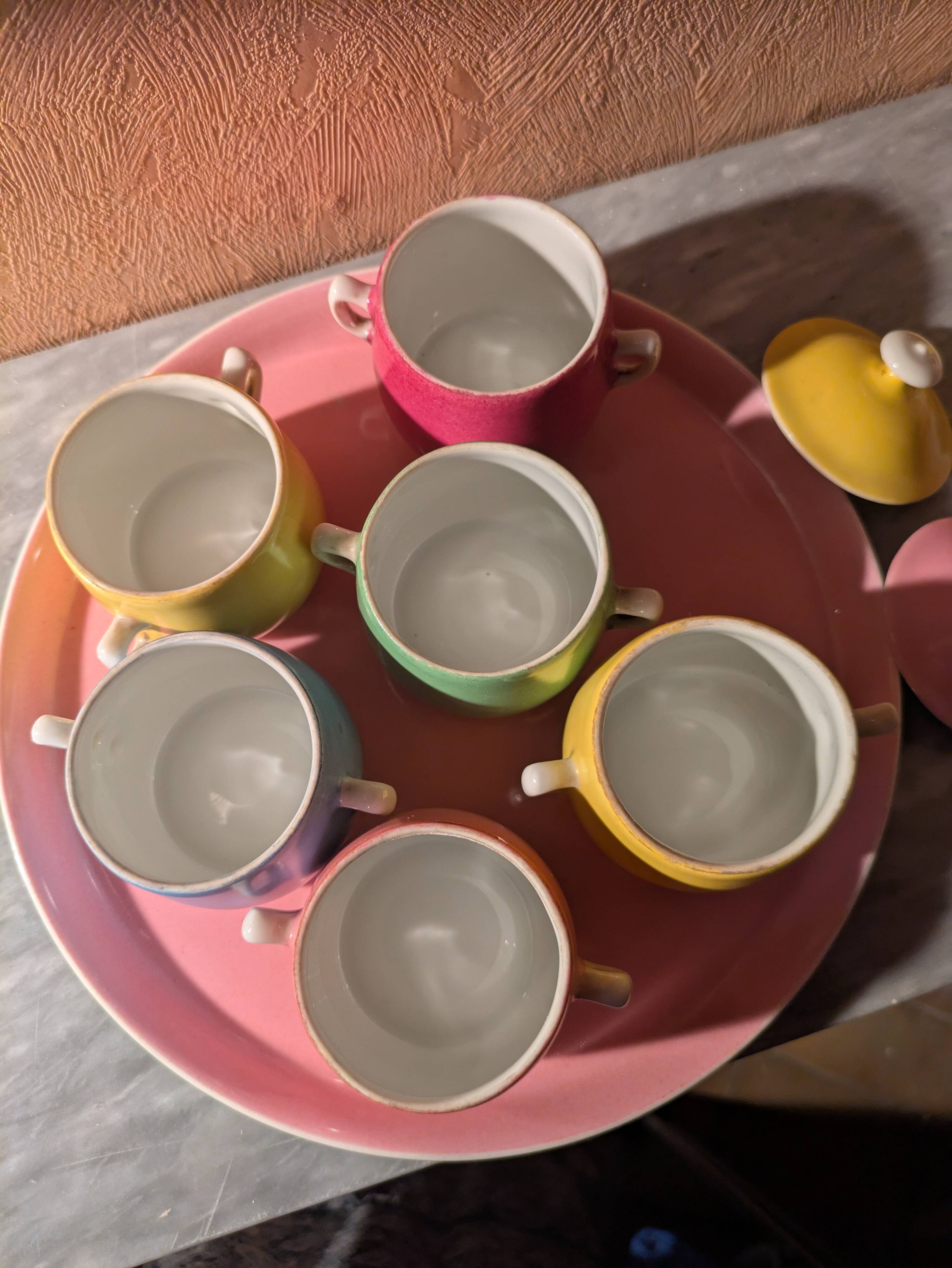 6 small porcelain cream pots from Limoges with a tray.