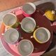 6 small porcelain cream pots from Limoges with a tray.