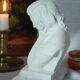 Limestone bust young girl who reads
