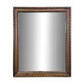 Miroir Napoléon III à cadre en bois sculpté et doré