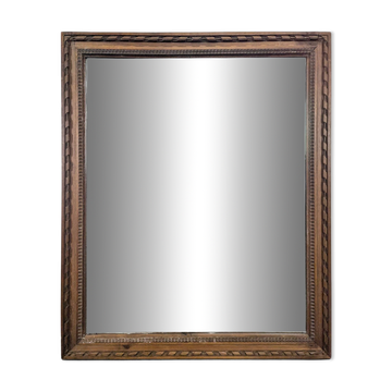 Napoleon III mirror with a carved and gilded wooden frame