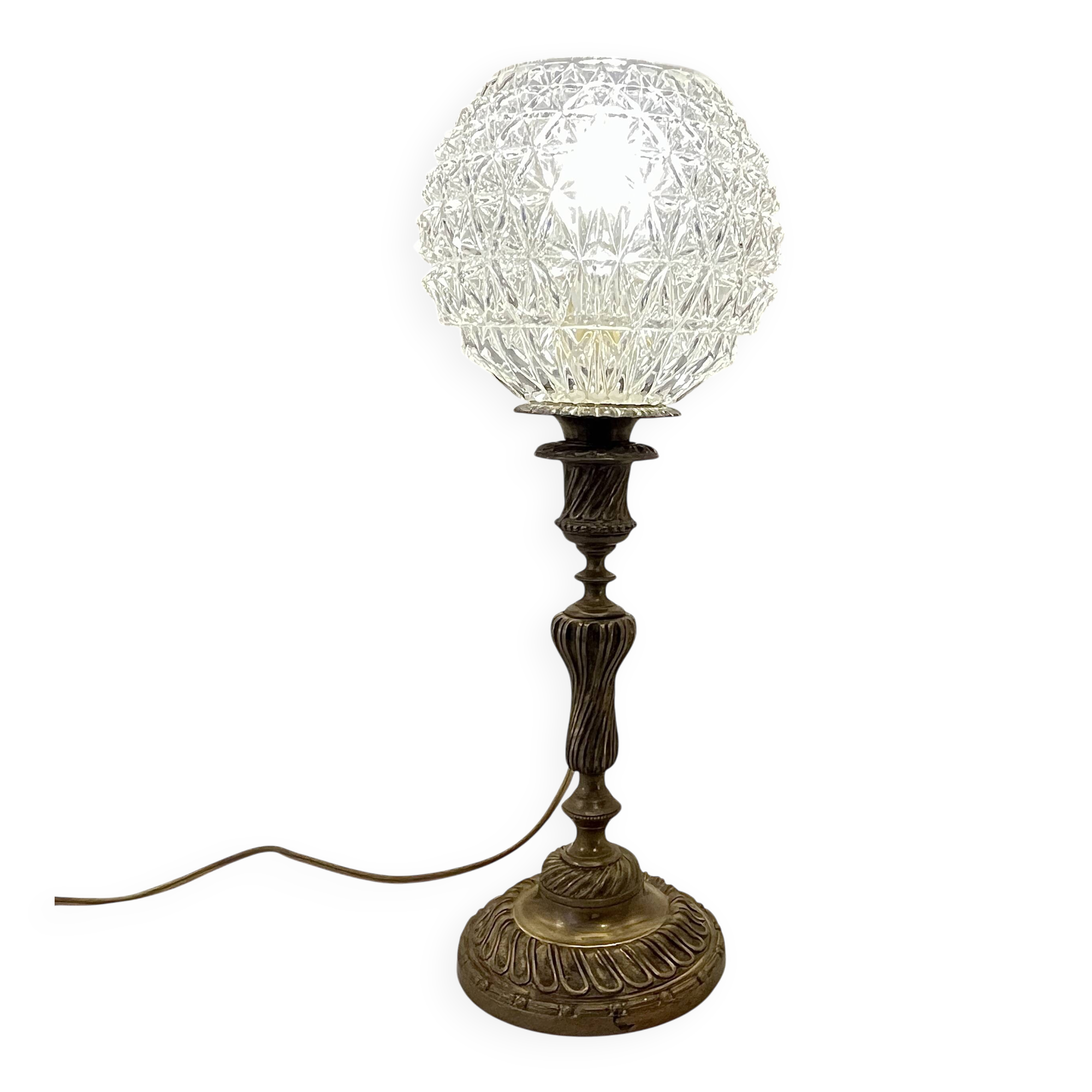 Antique brass foot lamp with glass globe and diamond point.
