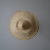 Hand-woven wicker straw hat, artisanal production, decorative object, bohemian ethnic countryside
