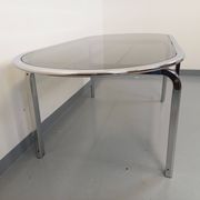 Vintage oval dining table in smoked glass and chrome metal, Space Age style.