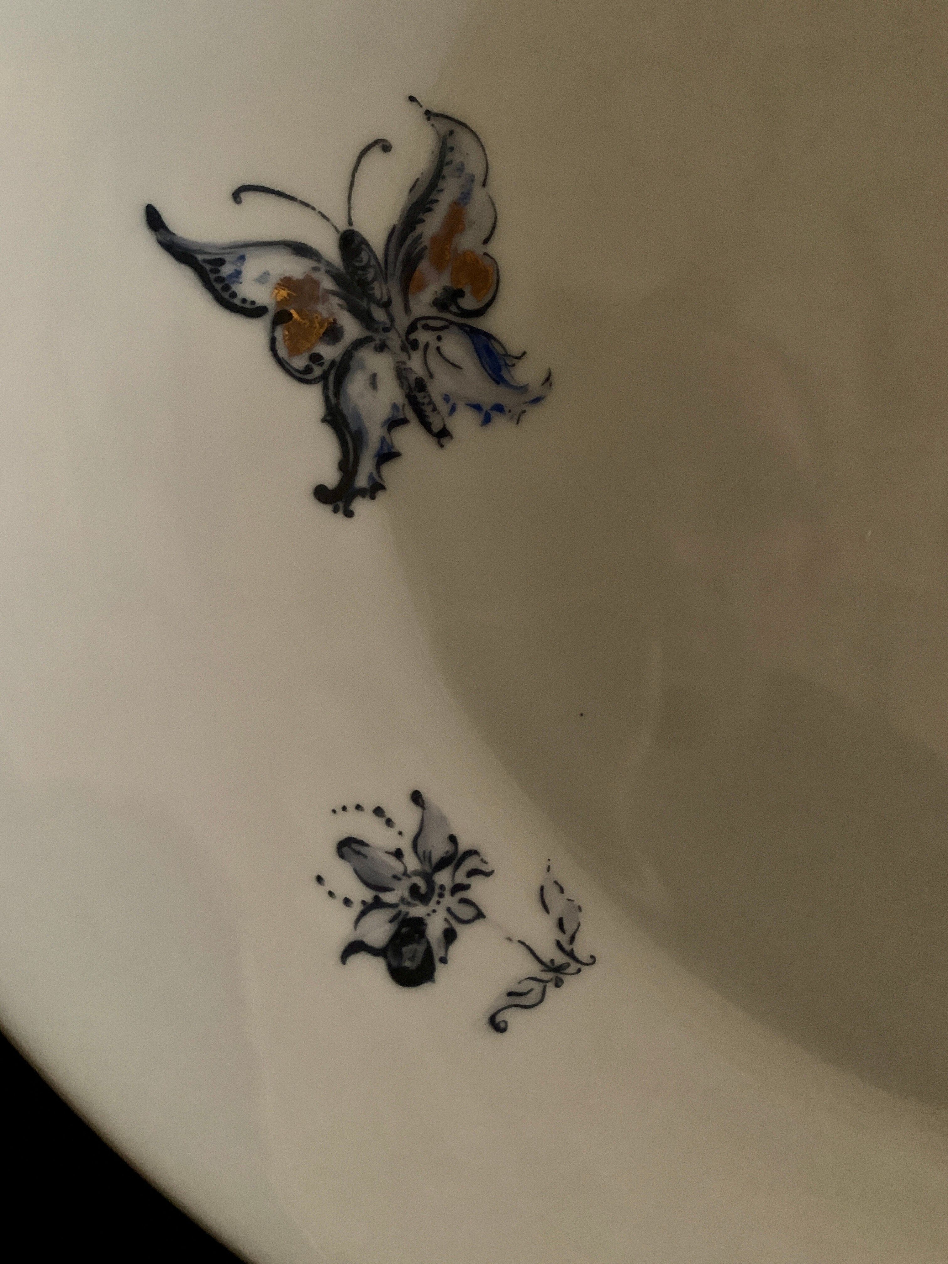 Plate signed Arsberg, "The Buffoon" after a model from the Royal Manufacture of Sèvres.