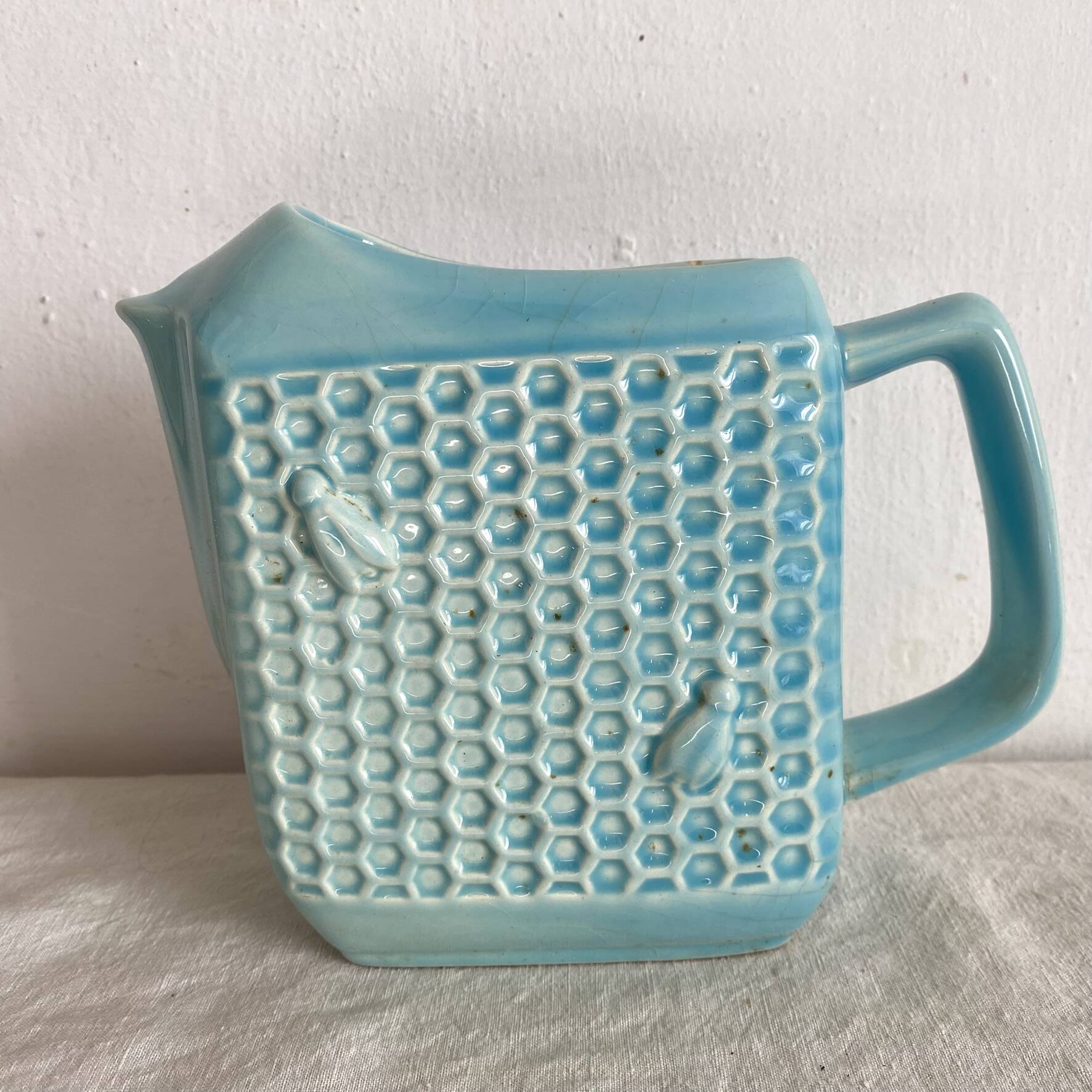 St Clément earthenware jug with bee decoration.