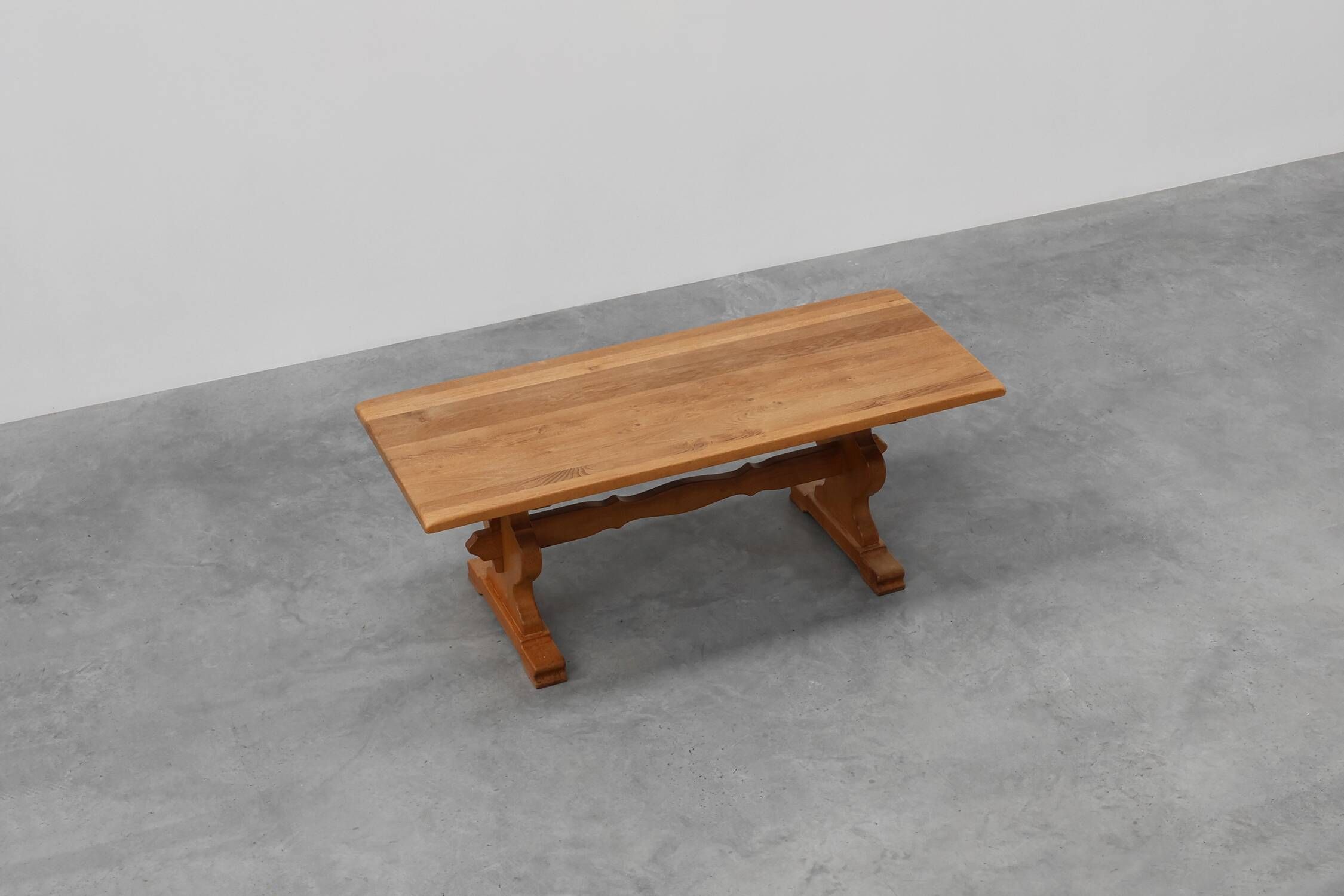20th Century French oak trestle table with scalloped legs and plank top
