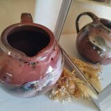 Stoneware pitcher by Matthieu Liévois in shades of red