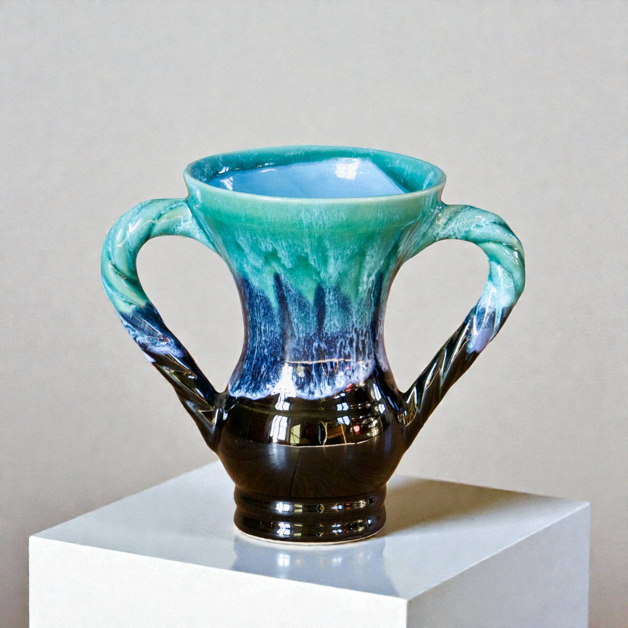 Ancient amphora vase in turquoise glazed stoneware.