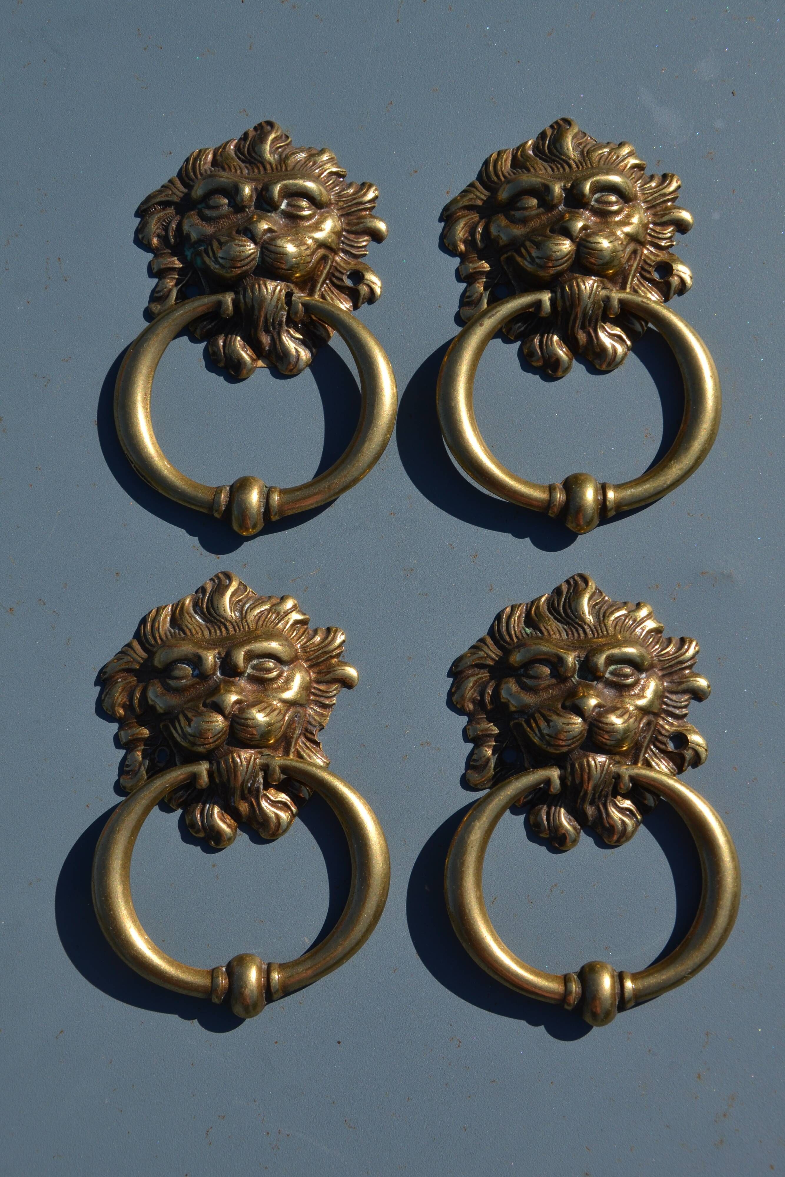4 antique lion head furniture handles from La Samaritaine.