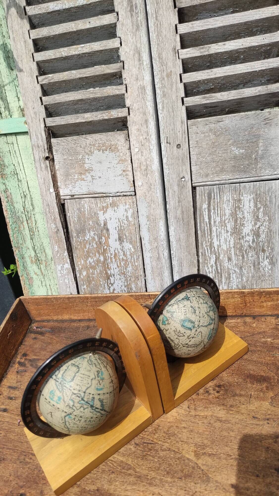 Pair of greenhouses vintage wooden books world map