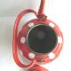 Old vintage kettle in red enamelled sheet metal, with white polka dots