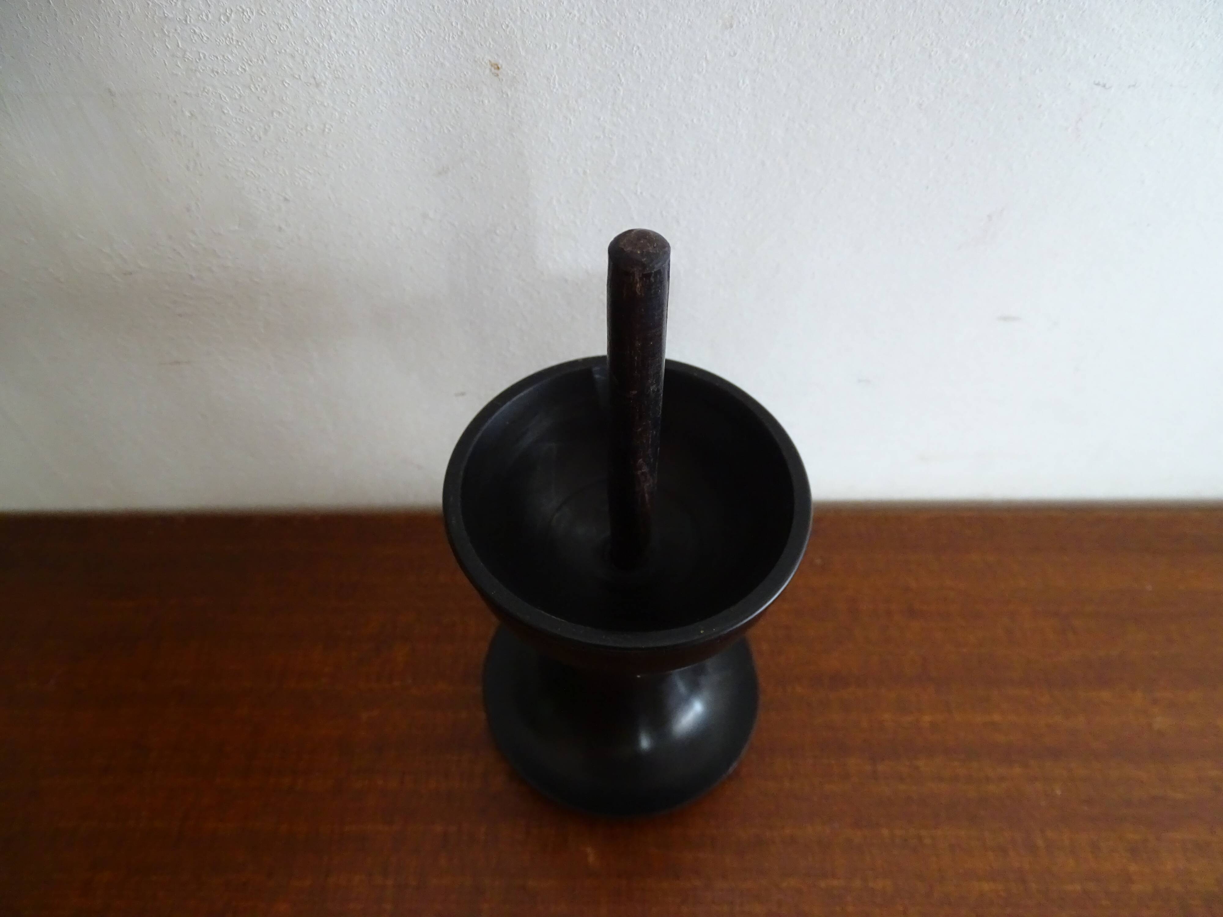 Ostrich egg on blackened wooden base - object of curiosity