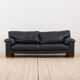 Black leather mid century 2,5 seater sofa