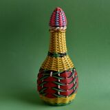Glass bottle covered with multicolored scoubidou