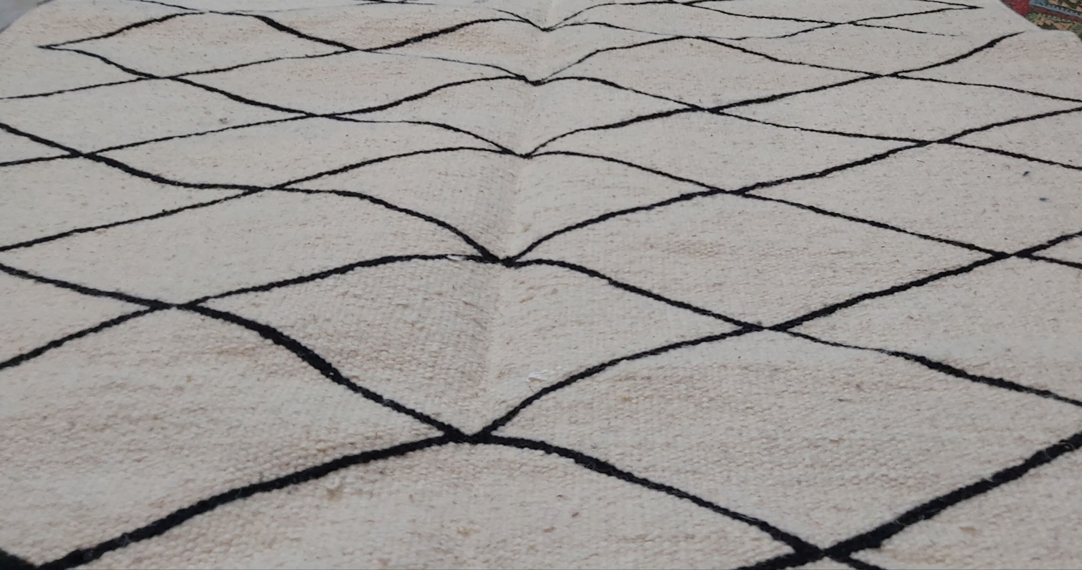 Handmade moroccan beige and black wool rug 192x118cm