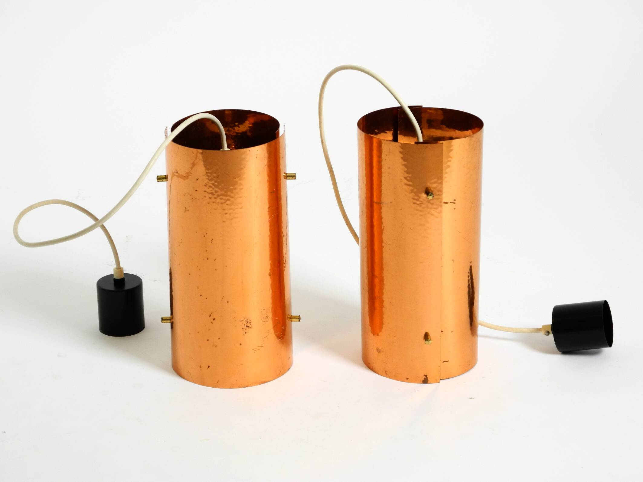 Two 50s tube pendant lamps consisting of two screwed-together copper bowls