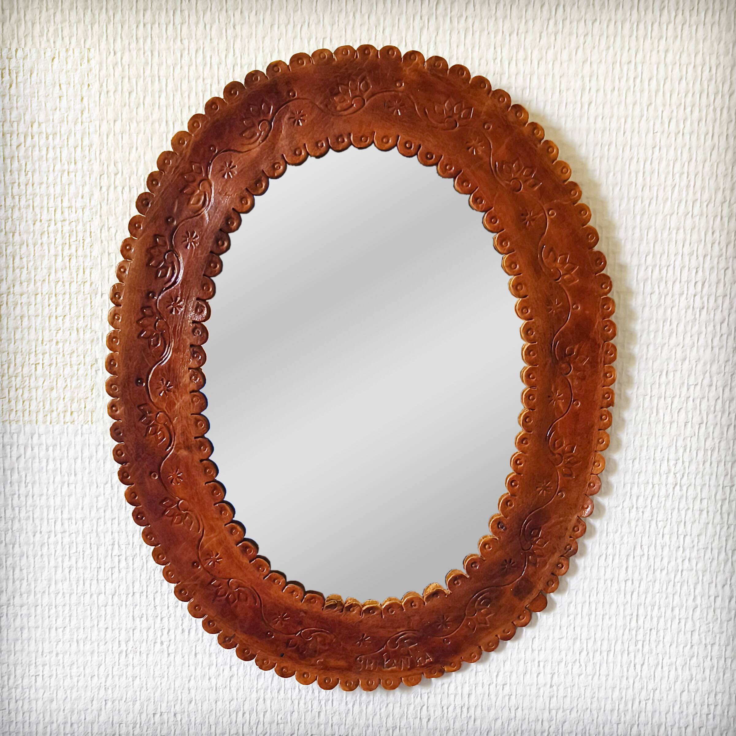 Leather repoussé mirror, Sri Lanka, 1960s