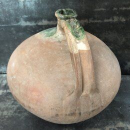 Large old jug cooked buried