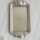 Metal butter dish and thick rectangular glass bowl.