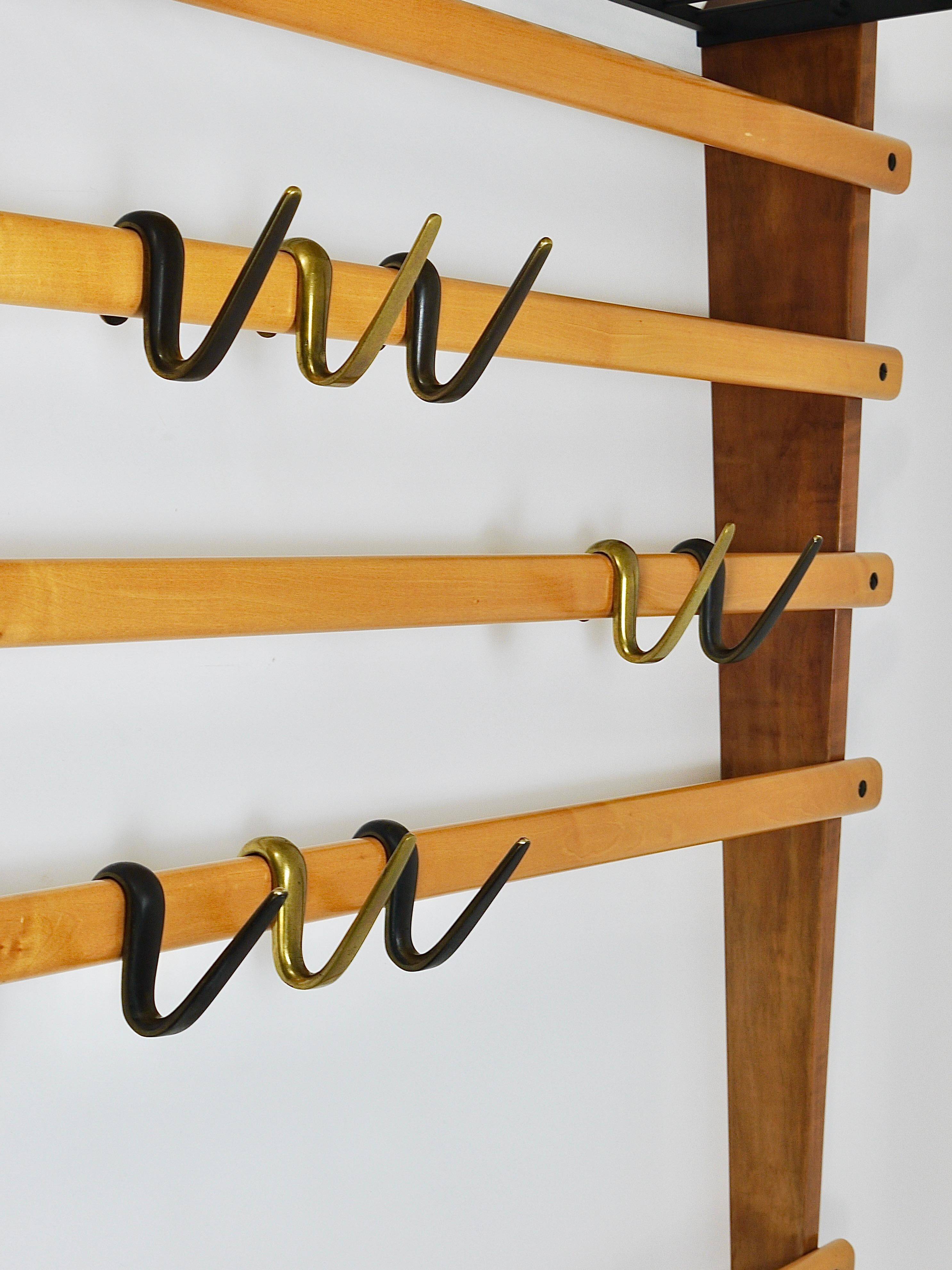 Rare coat rack by Carl Auböck with hat rack, cabinet, brass, walnut and beech, 1950s.