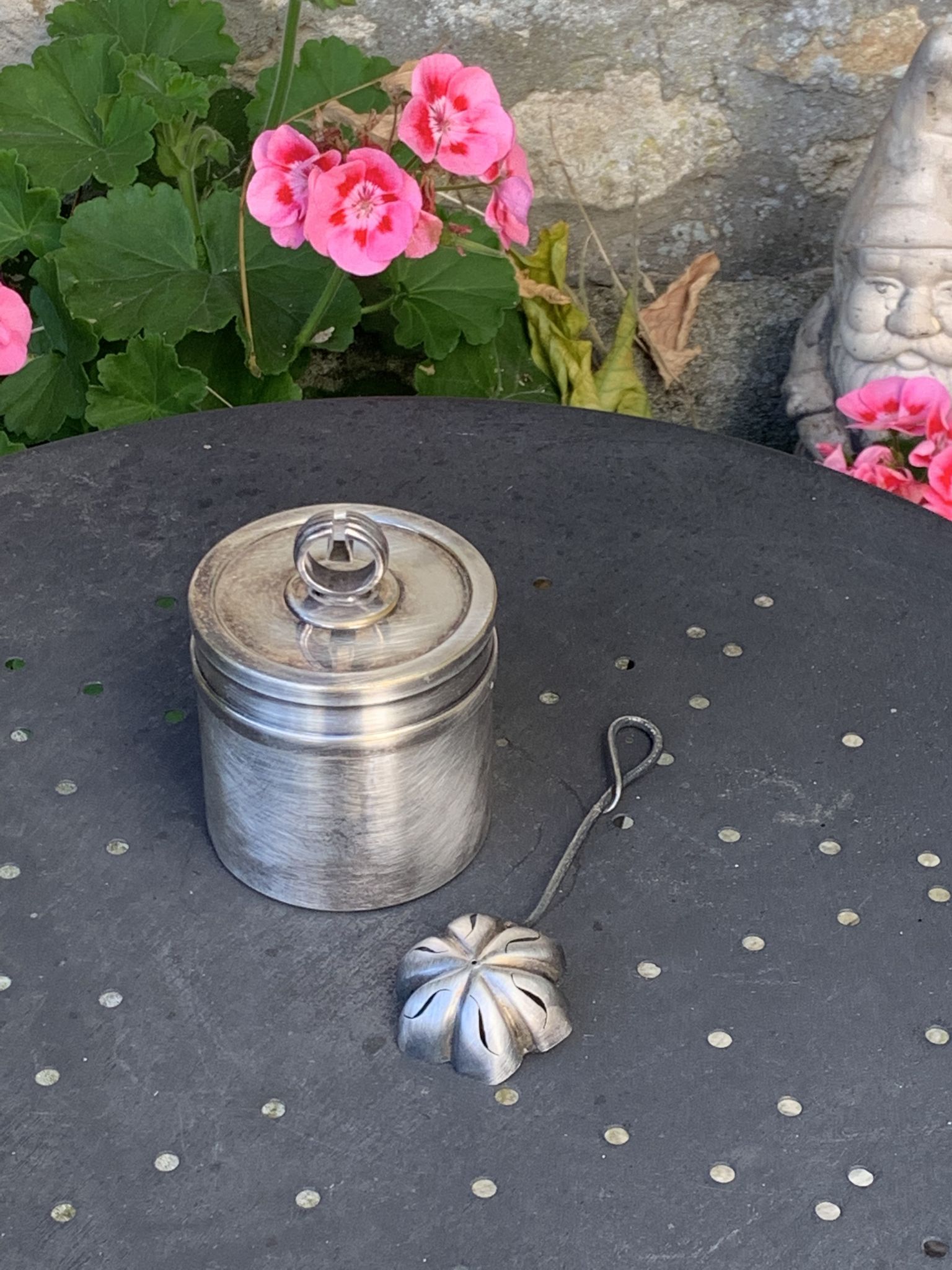 Sprinkling spoon and art deco sugar pot in silver metal