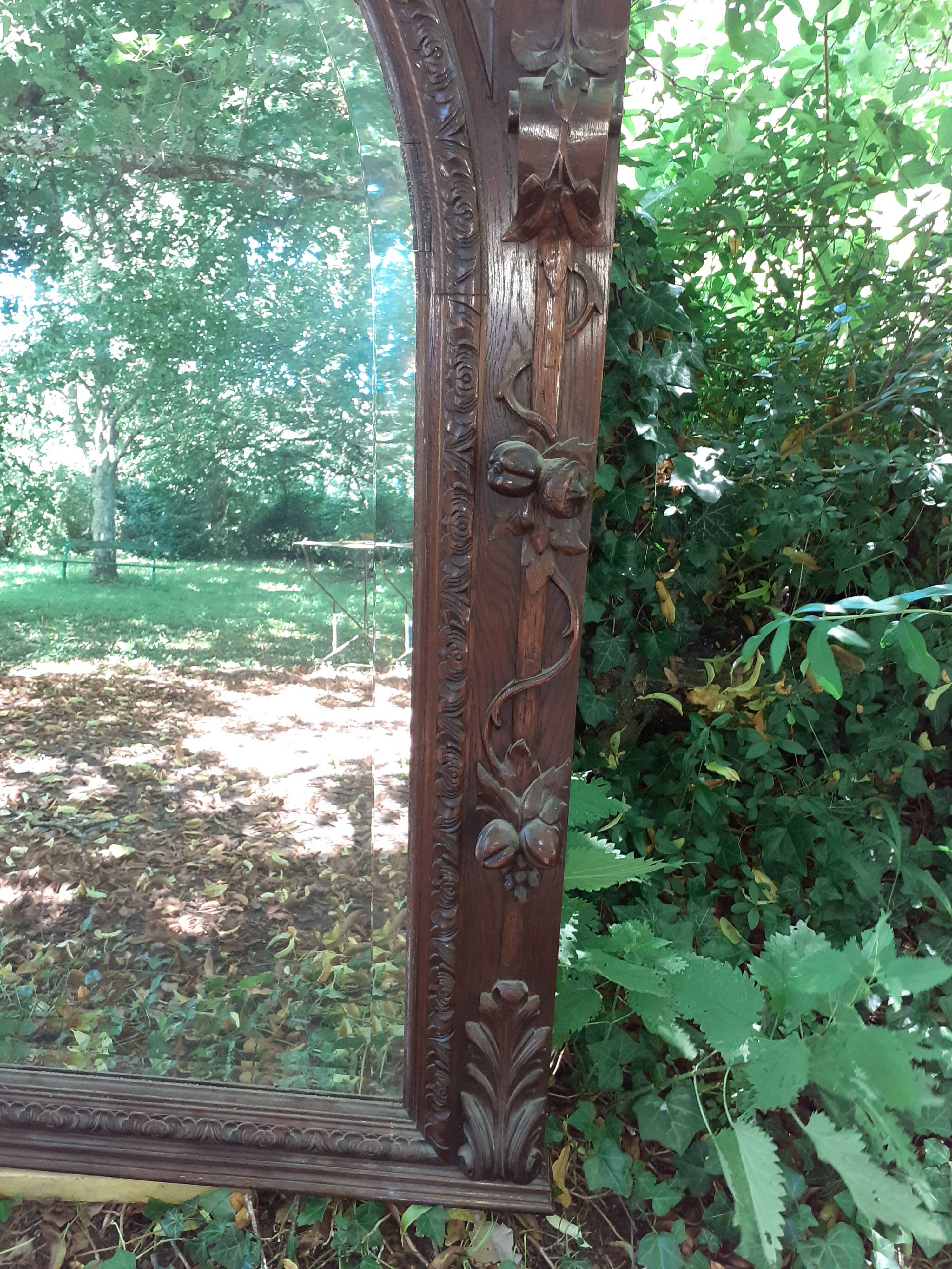Trumeau mirror beveled in carved oak 104x144cm