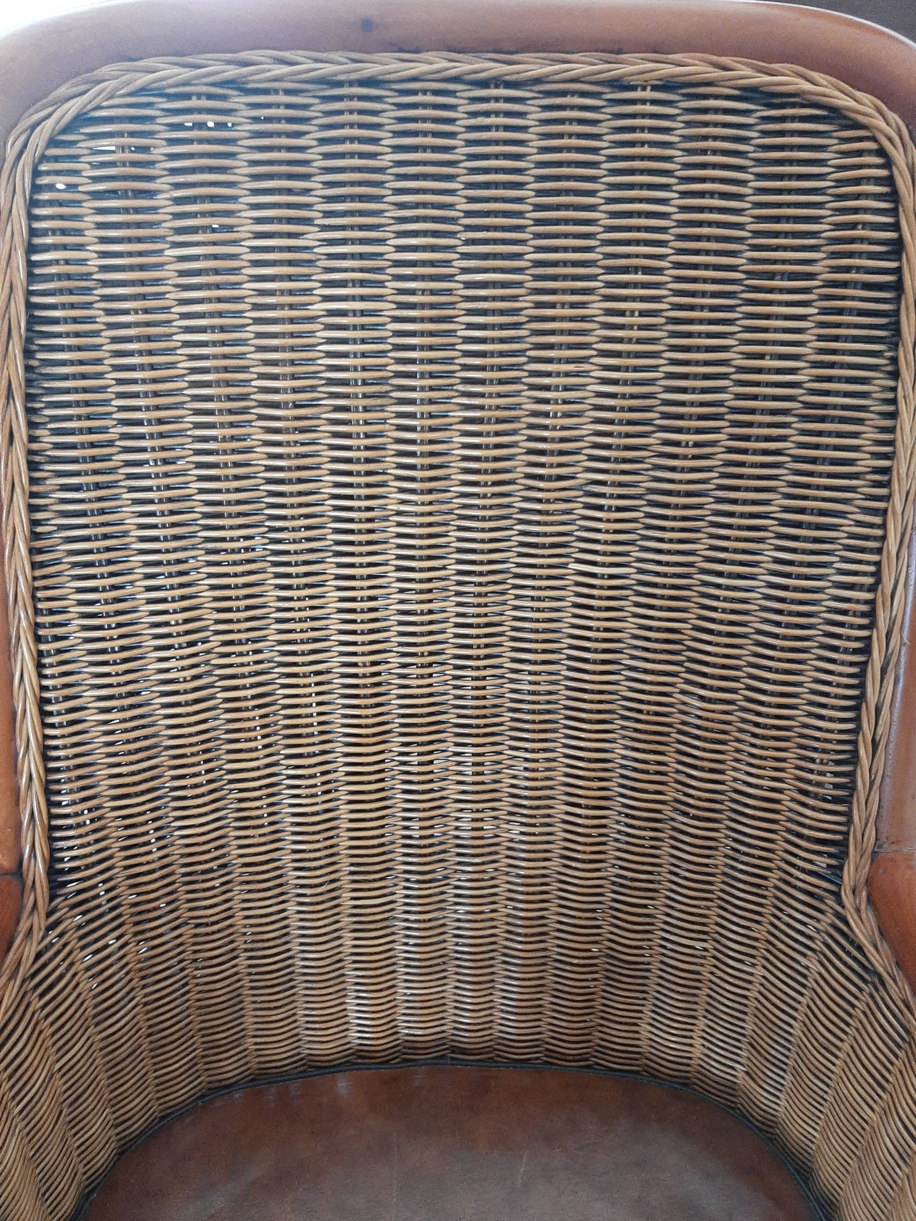 Armchair in woven rattan and exotic wood