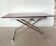 Table relevable vintage verre rouge et chrome-design 1970/1980