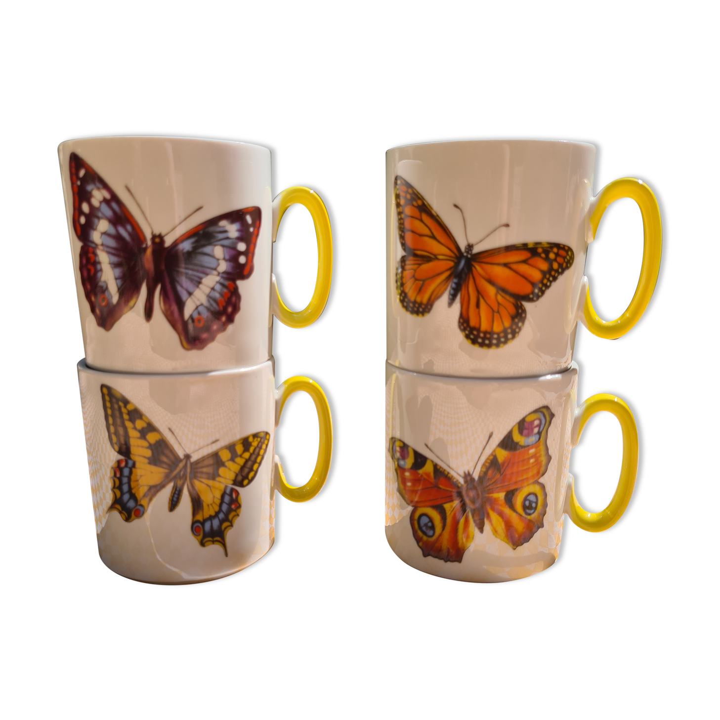 Four mugs decorated with Villeroy and Boch butterflies