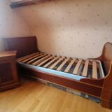 Bed with cherry wood base and bedside table
