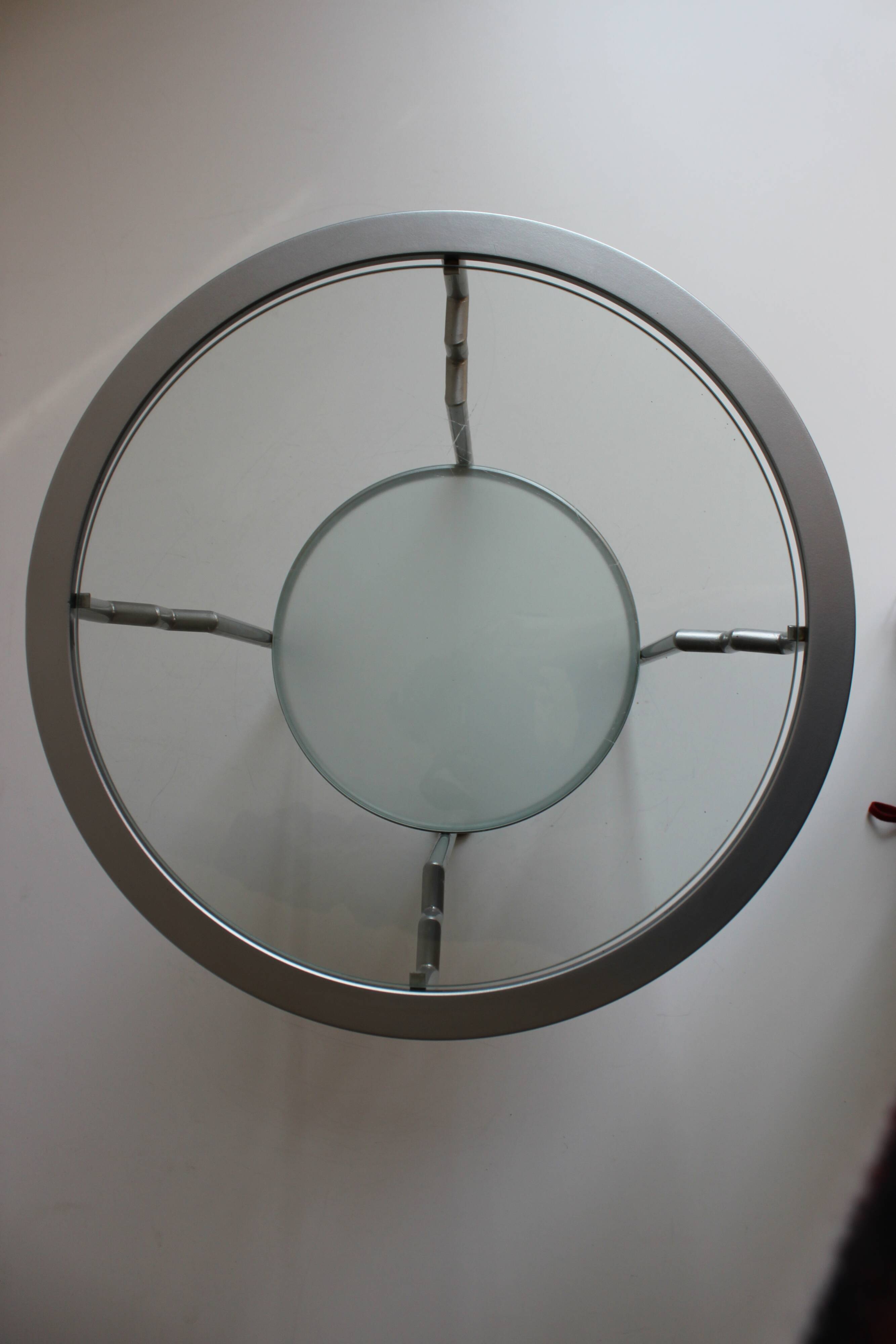 Postmodern round glass  and steel side table, 1980s.