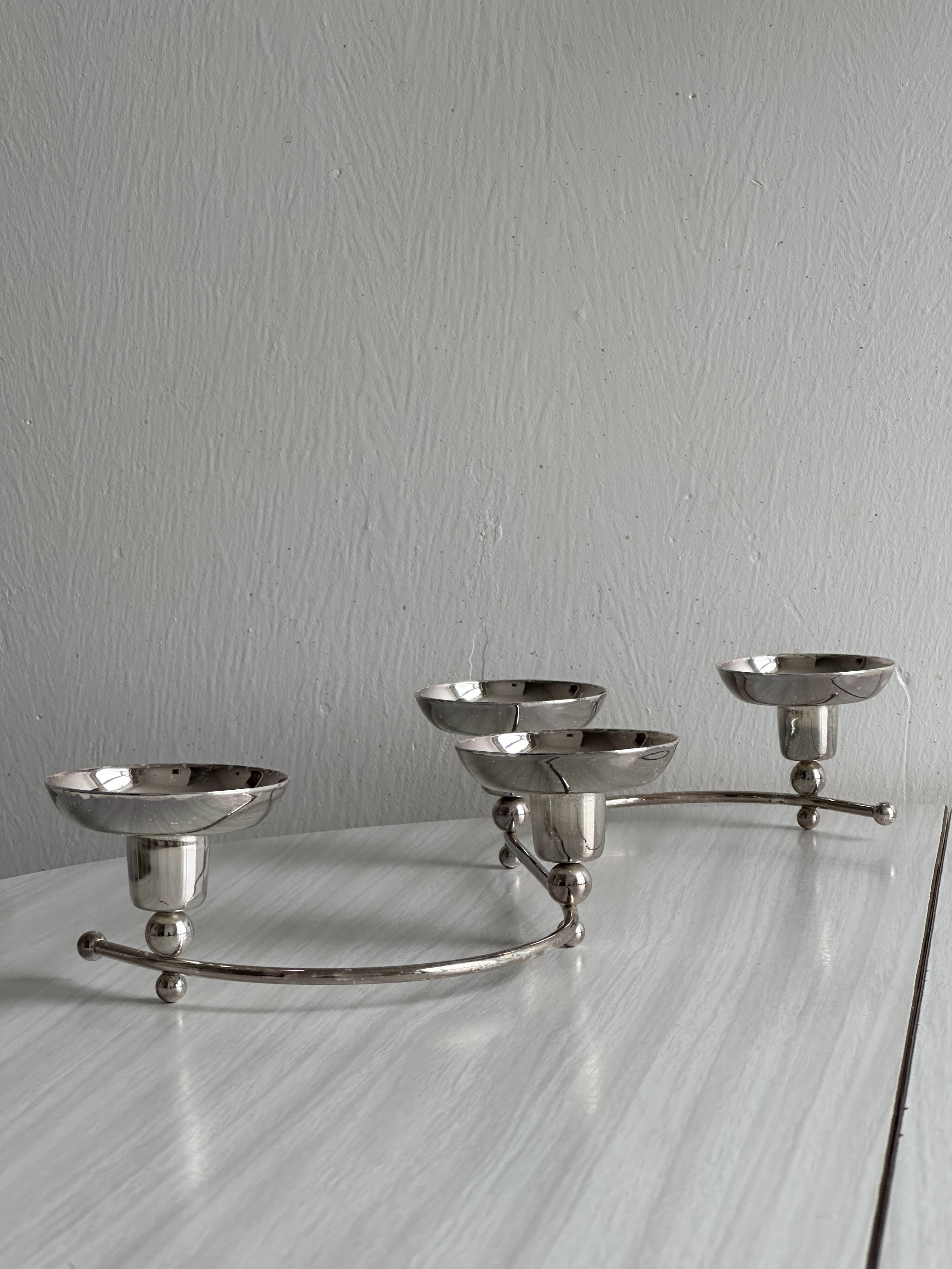 Shiny stainless steel candlestick holder