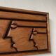 Bas relief cadre bois motifs visages