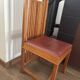 "Frank Lloyd Wright set with a table and its eight chairs."