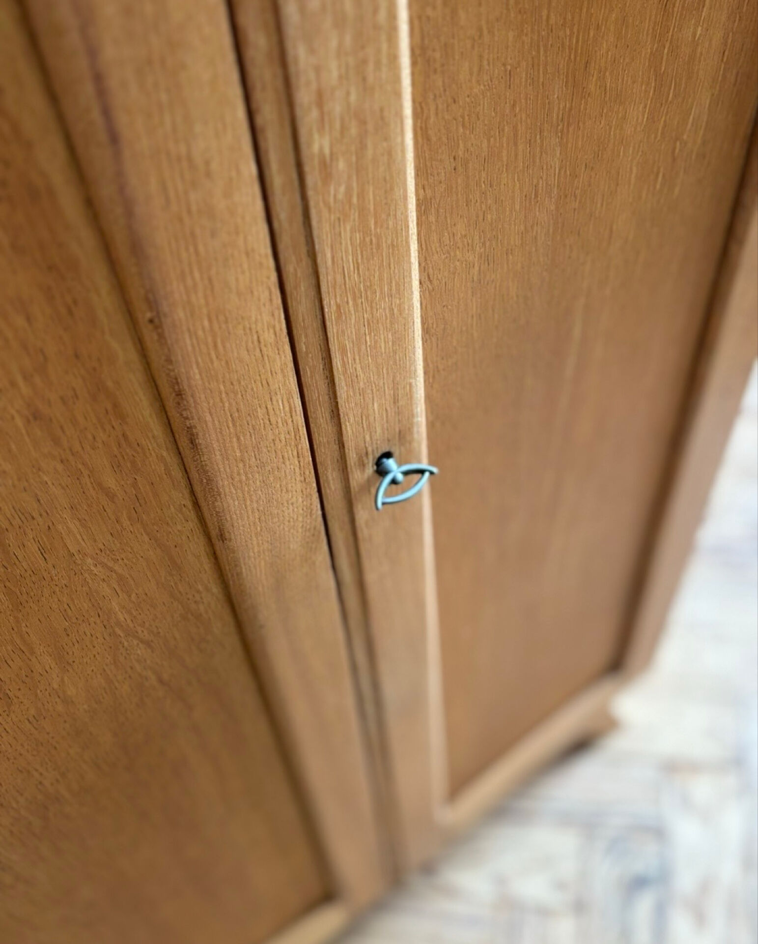 Small oak cabinet with tapered legs.
