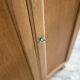 Small oak cabinet with tapered legs.