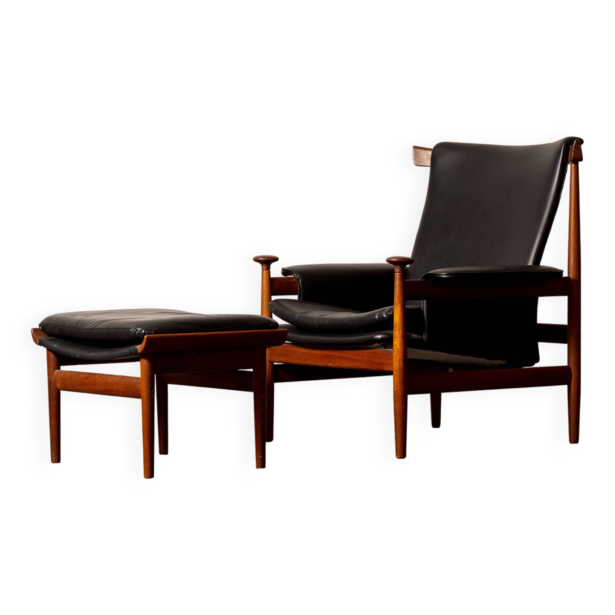 Finished Juhl armchair and its ottoman.