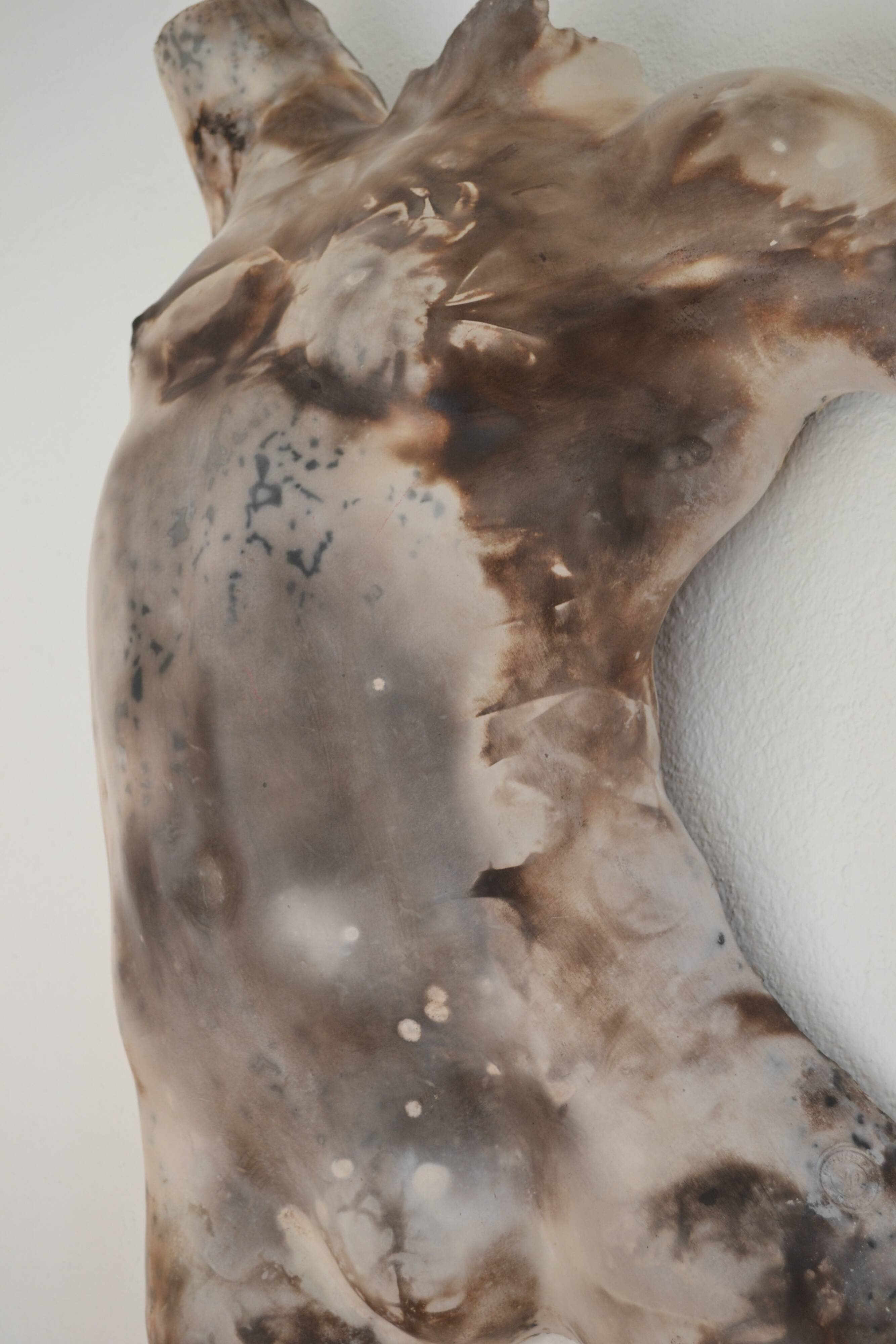 Male torso sculpture by patinated casting, signed to be identified.